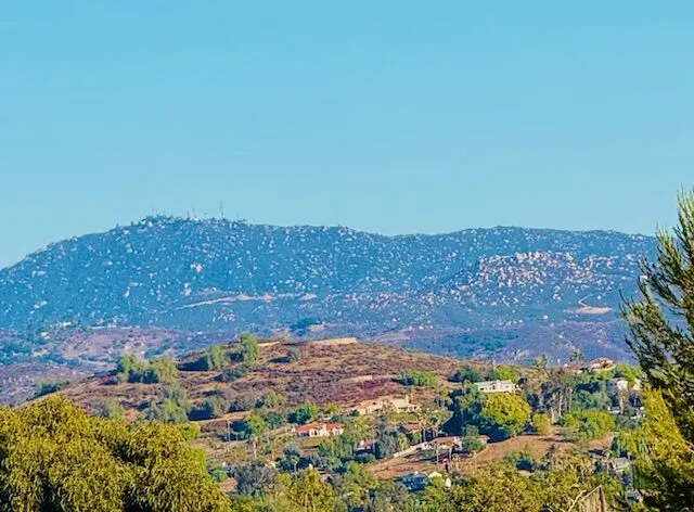 Looking across the rural valley toward the surrounding ridgelines.