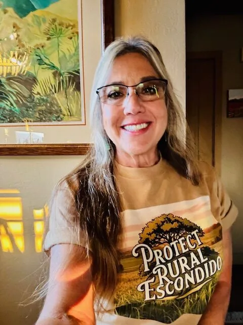 A supporter wearing a Protect Rural Escondido shirt.